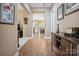 Hallway boasting tile flooring, decorative furnishings, and an entryway leading to a living area at 5524 Elk Knob Ct, Denver, NC 28037