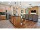 Modern kitchen featuring stainless steel appliances and a breakfast bar with granite countertops at 5524 Elk Knob Ct, Denver, NC 28037