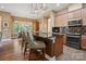Stylish kitchen with modern appliances, hardwood floors, and a breakfast bar for dining at 5524 Elk Knob Ct, Denver, NC 28037