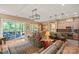 Open-concept living area featuring hardwood floors and seamless transition to the outdoors at 5524 Elk Knob Ct, Denver, NC 28037