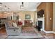 Spacious living room boasts hardwood floors, a fireplace, and an open layout to the kitchen at 5524 Elk Knob Ct, Denver, NC 28037