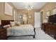 Comfortable main bedroom showcasing neutral tones, a television, and ensuite bathroom entrance at 5524 Elk Knob Ct, Denver, NC 28037