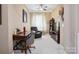 This home office features a ceiling fan, traditional furnishings, and neutral carpet at 5524 Elk Knob Ct, Denver, NC 28037