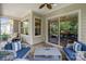 Covered patio with brick floors, comfortable seating, and a view of the backyard at 5524 Elk Knob Ct, Denver, NC 28037