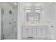 Bright bathroom with a glass-enclosed shower, double sinks, and modern fixtures at 5728 Mantario Dr, Charlotte, NC 28269