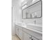Modern bathroom with double vanity, square sinks, and a sleek, minimalist design with black hardware at 5728 Mantario Dr, Charlotte, NC 28269