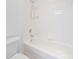 Clean, well-lit bathroom featuring a bright white tub with tile surround and modern fixtures at 5728 Mantario Dr, Charlotte, NC 28269