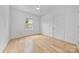 Well-lit bedroom with hardwood floors, a window, and a crisp, clean aesthetic at 5728 Mantario Dr, Charlotte, NC 28269