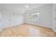 Bright bedroom with hardwood floors, a ceiling fan, and whimsical wall decals at 5728 Mantario Dr, Charlotte, NC 28269