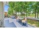 Charming deck area with water view, featuring a dining set for al fresco meals at 5728 Mantario Dr, Charlotte, NC 28269
