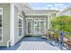 Exterior deck featuring outdoor seating, complemented by lush landscaping at 5728 Mantario Dr, Charlotte, NC 28269