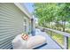Spacious deck with chaise lounge, offering a relaxing view of the surrounding greenery at 5728 Mantario Dr, Charlotte, NC 28269