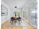 Cozy dining area with hardwood floors, a round table, and ample natural light at 5728 Mantario Dr, Charlotte, NC 28269