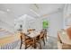 Bright dining room with modern light fixture, wood table and chairs, and large window at 5728 Mantario Dr, Charlotte, NC 28269