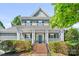 Charming two-story home with a welcoming front porch and well-manicured landscaping at 5728 Mantario Dr, Charlotte, NC 28269