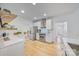 Spacious kitchen with hardwood floors, stainless steel appliances, and white cabinetry at 5728 Mantario Dr, Charlotte, NC 28269