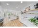 Bright and open kitchen with stainless steel appliances and modern white cabinetry at 5728 Mantario Dr, Charlotte, NC 28269