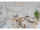 Open living area featuring views to the kitchen, dining, and abundant natural light at 5728 Mantario Dr, Charlotte, NC 28269