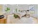 Bright main bedroom with hardwood floors, multiple windows, and a ceiling fan at 5728 Mantario Dr, Charlotte, NC 28269