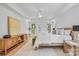 Spacious main bedroom with hardwood floors, neutral decor, and ample natural light at 5728 Mantario Dr, Charlotte, NC 28269