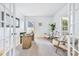 Bright home office featuring French doors, neutral decor, stylish furniture, and natural light at 5728 Mantario Dr, Charlotte, NC 28269