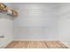Spacious walk-in closet featuring hardwood floors and multiple levels of white wire shelving for ample storage at 5728 Mantario Dr, Charlotte, NC 28269