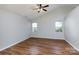 Spacious bedroom featuring hardwood floors, neutral paint, and natural light at 5806 Autumn Trace Ln, Indian Trail, NC 28079