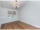 Cozy dining room with hardwood floors, chair rail, and natural light at 5806 Autumn Trace Ln, Indian Trail, NC 28079