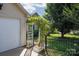 Home featuring lovely landscaping, an arbor with climbing vines, and a garage at 5806 Autumn Trace Ln, Indian Trail, NC 28079