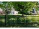 Well-maintained yard with lawn, decorative fence and trees at 5806 Autumn Trace Ln, Indian Trail, NC 28079