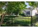 Lovely home with decorative fence, green lawn, and blooming landscaping at 5806 Autumn Trace Ln, Indian Trail, NC 28079