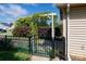 Charming gate with lush vines and a hedge in a well-maintained yard at 5806 Autumn Trace Ln, Indian Trail, NC 28079