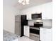 Well-equipped kitchen with stainless steel appliances, granite countertops, and white cabinetry at 5806 Autumn Trace Ln, Indian Trail, NC 28079