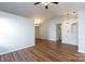 Bright, open living space with hardwood floors, fan, and modern lighting at 5806 Autumn Trace Ln, Indian Trail, NC 28079