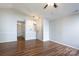 Spacious living room with beautiful floors, ceiling fan, and neutral paint at 5806 Autumn Trace Ln, Indian Trail, NC 28079