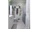 A charming bathroom featuring paneled walls, updated fixtures, and ample storage creates a cozy and functional space at 605 Impala Dr, Albemarle, NC 28001