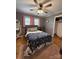 Cozy bedroom with hardwood floors and a wardrobe at 605 Impala Dr, Albemarle, NC 28001