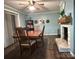 This dining room features hardwood floors, a fireplace, and plenty of space for a large table and gatherings at 605 Impala Dr, Albemarle, NC 28001