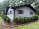 Charming painted brick home featuring wood shutters at 605 Impala Dr, Albemarle, NC 28001