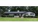 Charming brick home featuring a well-manicured lawn and lovely shrubbery at 605 Impala Dr, Albemarle, NC 28001