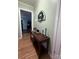 Hallway featuring a console table with decorative items and art at 605 Impala Dr, Albemarle, NC 28001