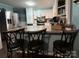 The kitchen features stainless steel appliances, updated countertops, and a breakfast bar, creating a delightful culinary space at 605 Impala Dr, Albemarle, NC 28001