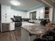 This updated kitchen features modern stainless steel appliances, granite countertops, and ample storage, perfect for any home chef at 605 Impala Dr, Albemarle, NC 28001