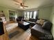 Inviting living room with comfortable seating and large windows at 605 Impala Dr, Albemarle, NC 28001