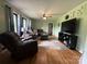 Spacious living room filled with natural light, and hardwood floors at 605 Impala Dr, Albemarle, NC 28001
