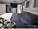 This main bedroom features an ensuite, a large window, and a well-sized closet, and offers comfortable accommodations at 605 Impala Dr, Albemarle, NC 28001