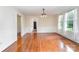 Bright dining room with hardwood floors, ideal for Gathering meals and entertaining guests at 6206 Hunter Ave, Charlotte, NC 28262