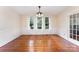 Dining area featuring hardwood floors, bead board trim, and natural light at 6206 Hunter Ave, Charlotte, NC 28262