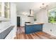 Stylish kitchen with stainless steel hood, butcher block countertops, and ample storage space at 6206 Hunter Ave, Charlotte, NC 28262