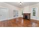 Bright living room with hardwood floors and fireplace, perfect for relaxation and entertaining at 6206 Hunter Ave, Charlotte, NC 28262